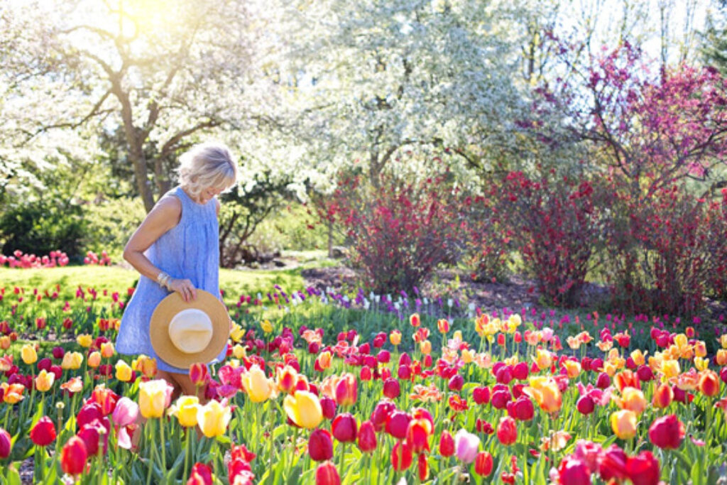 Woman standing in a flower garden