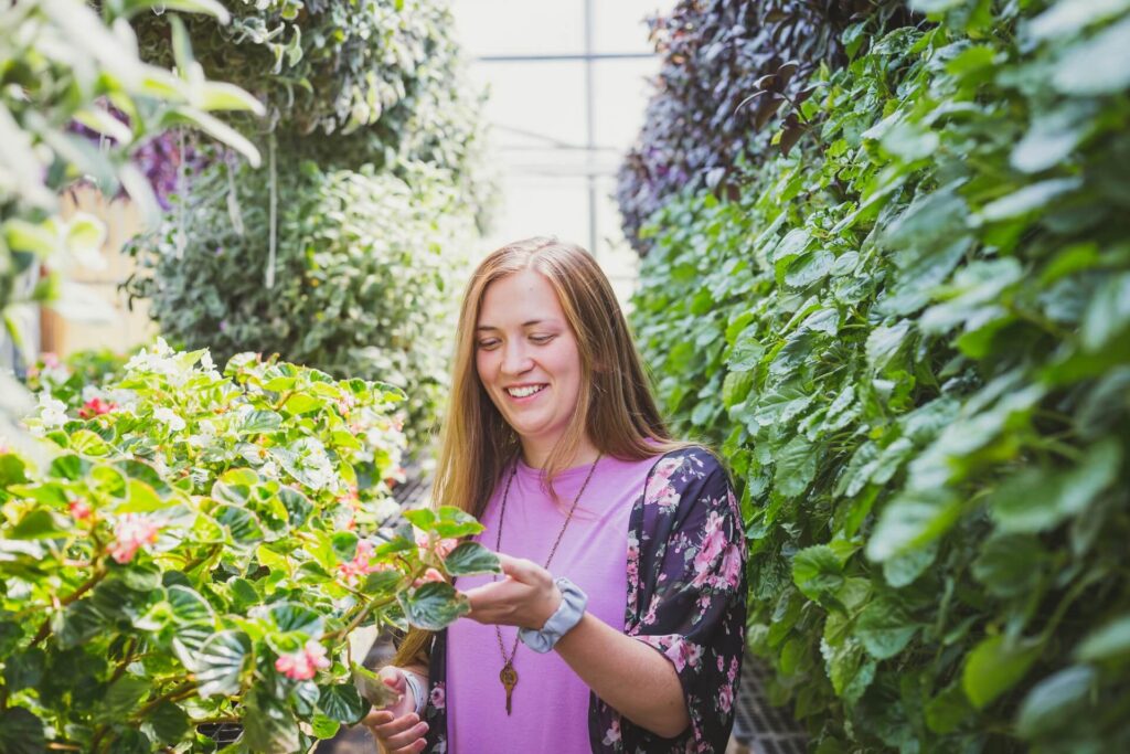 woman caring for plants