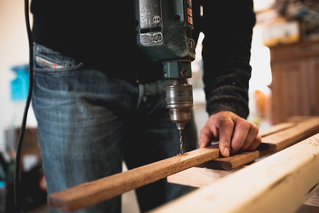 man holding a batten