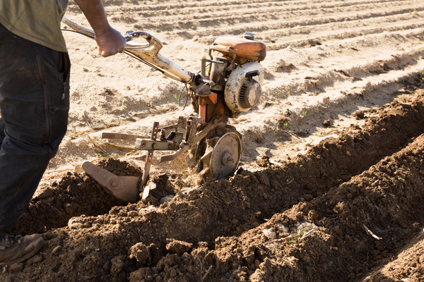 tilling soil with a machine